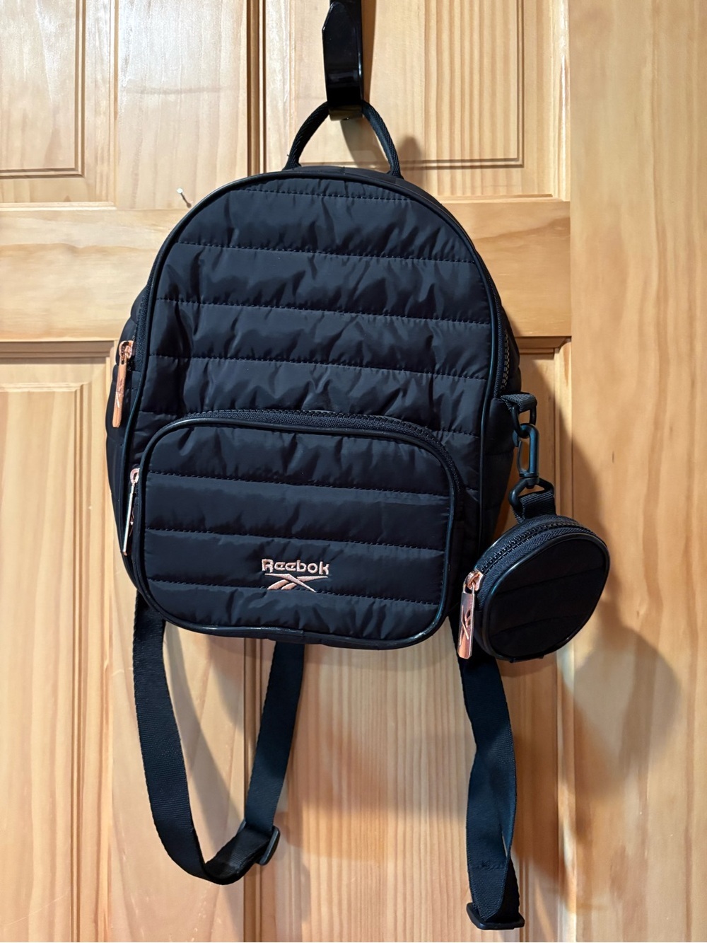 Reebok Women's Luna Quilted Mini Backpack with a detachable coin pouch in black